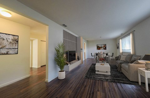 living room with large couch and tv console